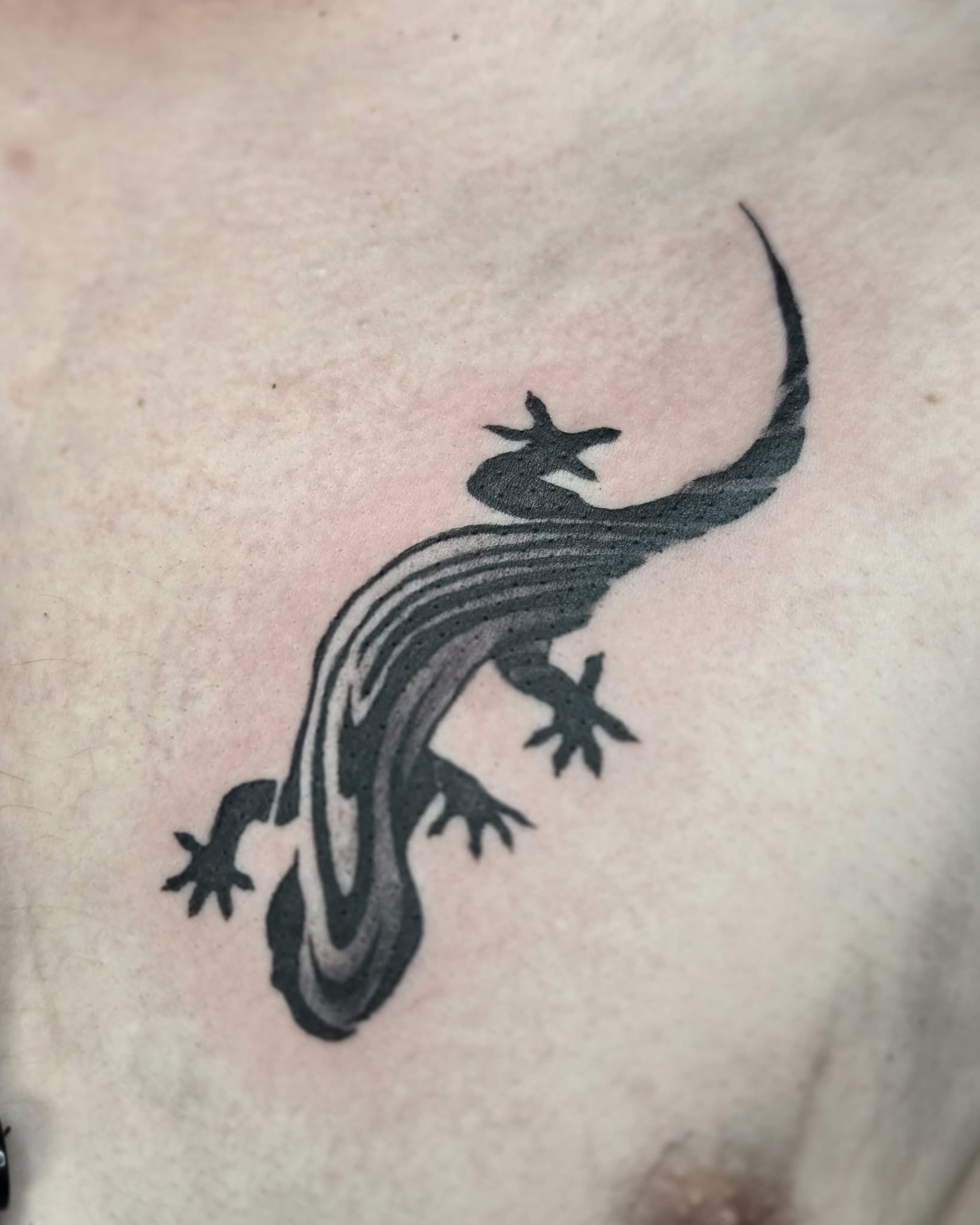 Black and grey lizard tattoo