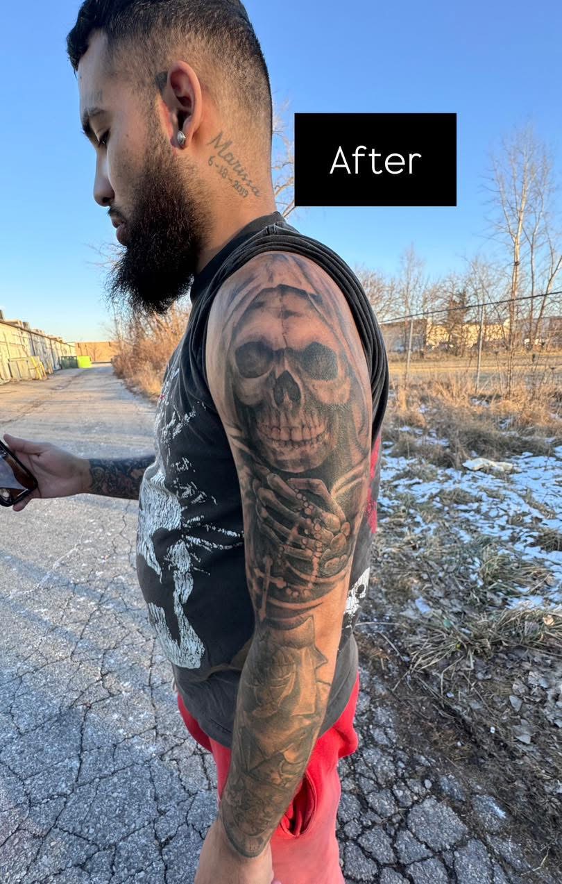 After: black and grey reaper sleeve covering the old jester tattoo