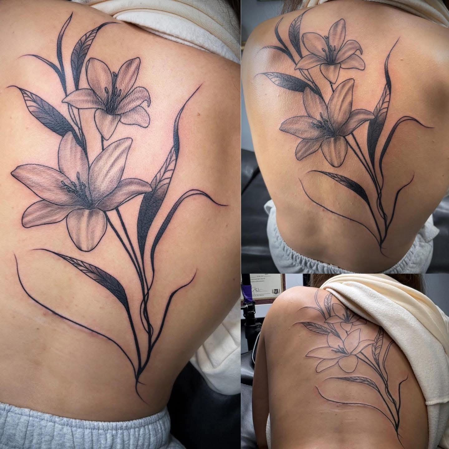 Fine-line black and grey lilies across a shoulder and back